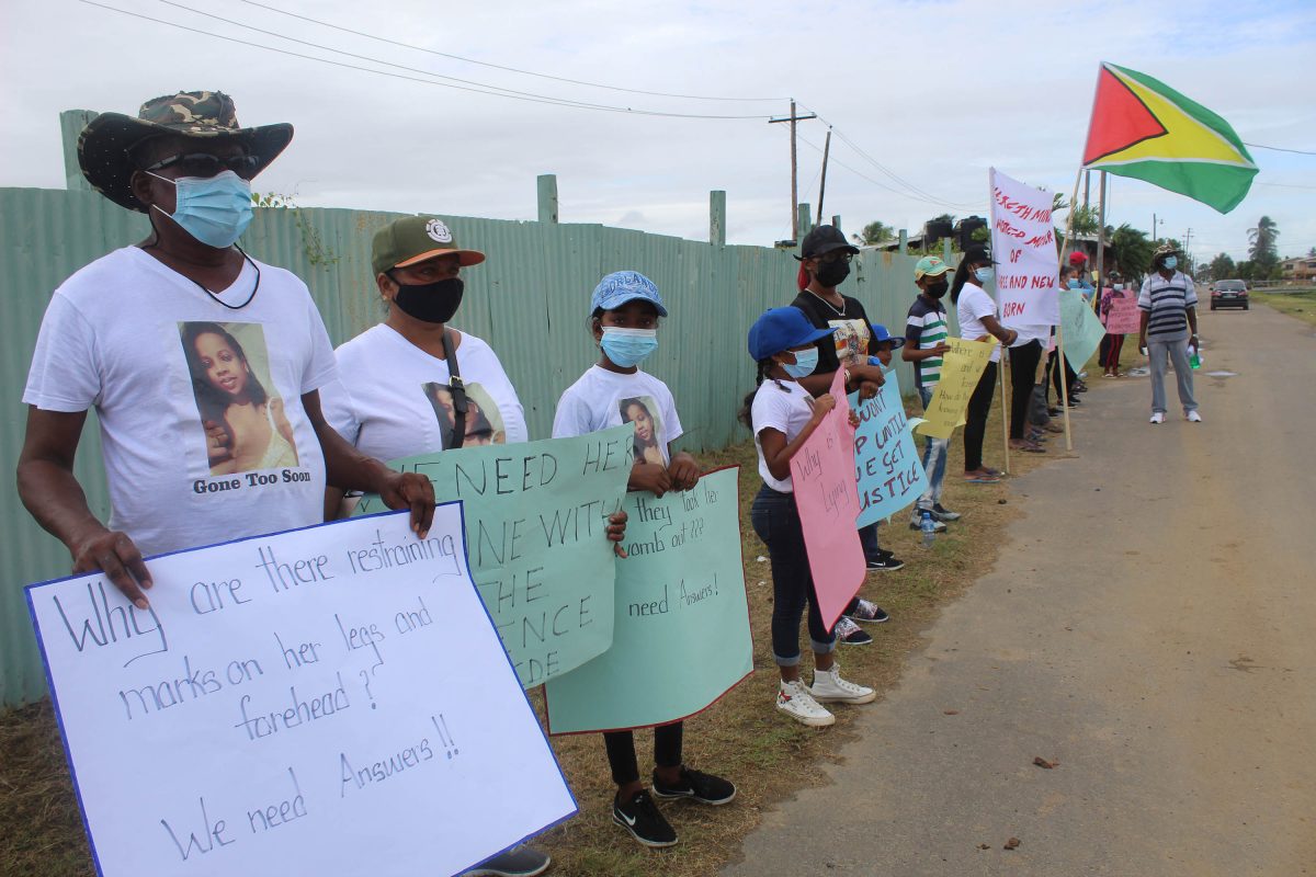Relatives of Vanessa Lewis-Sahadeo protesting yesterday across from the St. Francis Community Developers Headquarters, where they continued to call for justice for the Corentyne mother, who died after an unsuccessful delivery at the New Amsterdam Hospital.