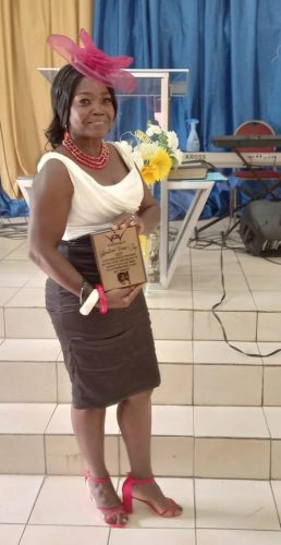 Beverly Bentham with the award she recently received from her church