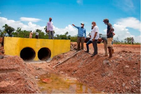 Approximately 280 residents of Haiowa Village and nearby communities in Region Nine are benefiting from the installation of drainage structures by the Ministry of Public Works, according to the Department of Public Information (DPI).
Minister of Public Works Juan Edghill (second from right) on Friday visited the worksite where culverts and other structures were installed through an $8.3 million contract that was awarded to D&R Construction and Machinery Rental. (DPI photo)