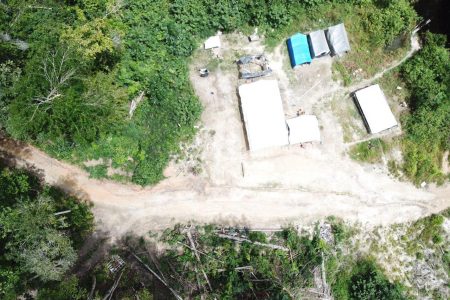 An aerial view of the illegally operated shop in the buffer zone before the Iwokrama monitoring team dismantled and removed it from the area. (Iwokrama Interna-tional Centre photo)