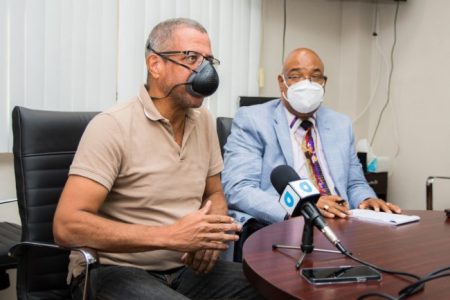 Minister of Public Work, Juan Edghill (right) and Engineer,  Marcel Gaskin, during Sunday’s discussion. (DPI photo)