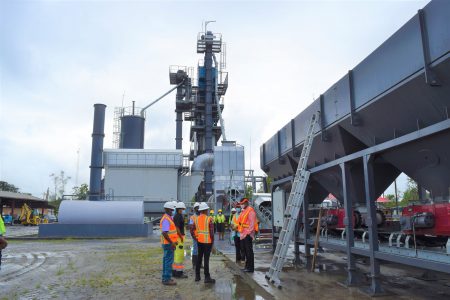 Minister of Public Works Juan Edghill along with the Chairman of the Demerara Harbour Bridge Corporation (DHBC) Ravie Ramcharitar and other senior officers during their visit to the Garden of Eden asphalt plant (Ministry of Public Works photo)