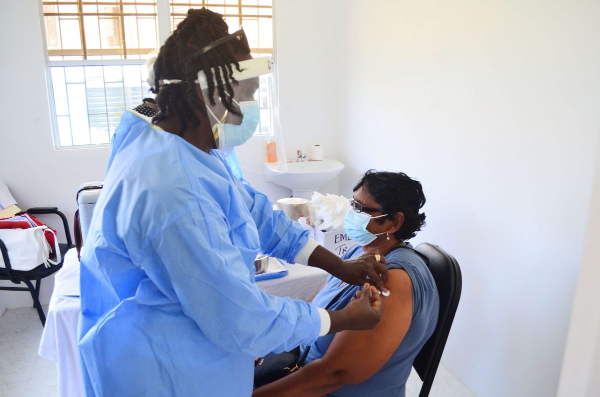 A woman being vaccinated yesterday at the Vreed-en-Hoop Health Centre (Photo by Orlando Charles)