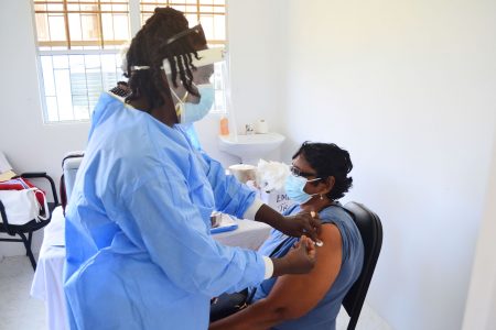 A woman being vaccinated yesterday at the Vreed-en-Hoop Health Centre (Photo by Orlando Charles)