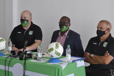 GFF President Wayne Forde (center) addresses the media in the presence of Golden Jaguars head-coach Marcio Maximo (right) and Technical Director Ian Greenwood yesterday.