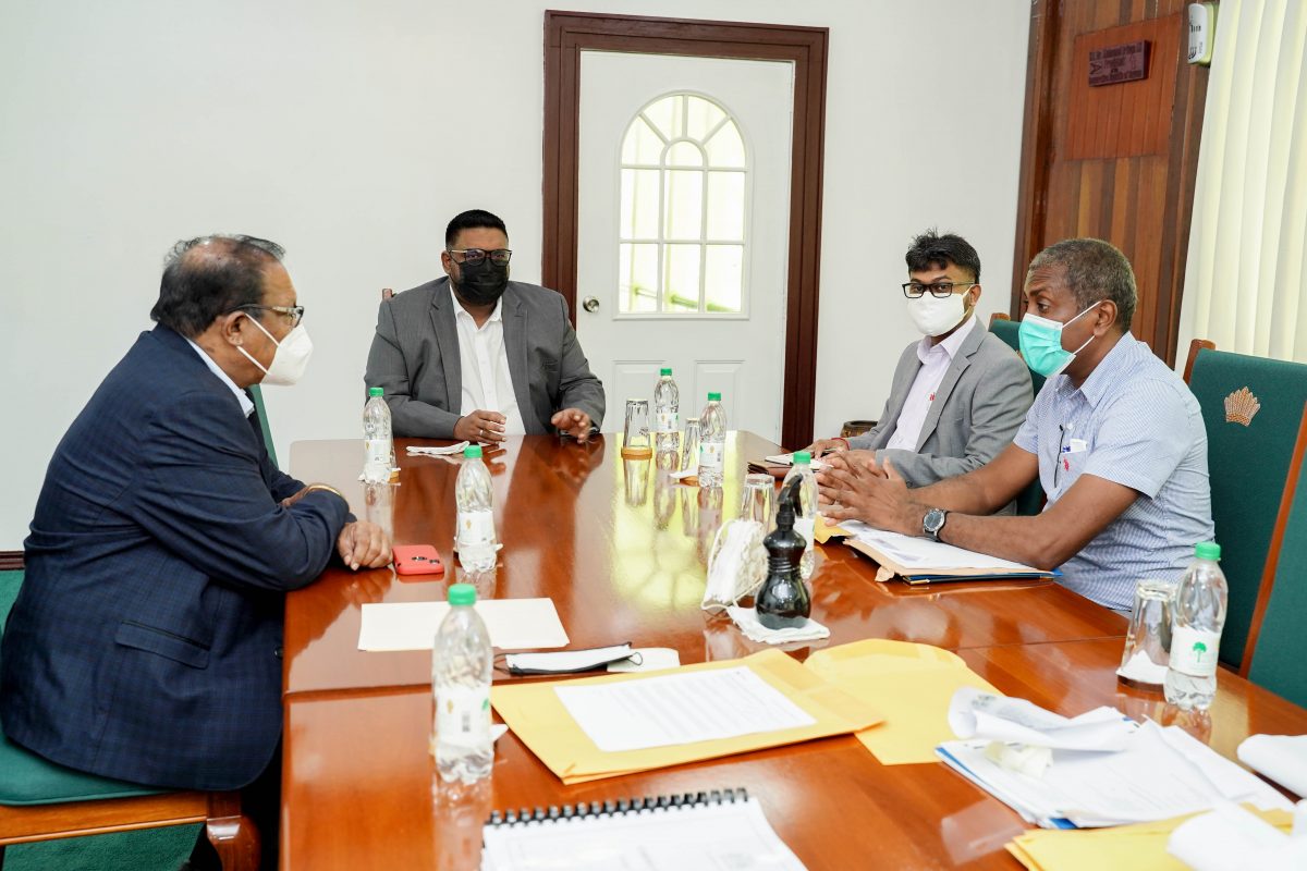 President Irfaan Ali (at head of table) with the Mayor of Georgetown, Ubraj Narine (second from right) and others. (Office of the President photo)