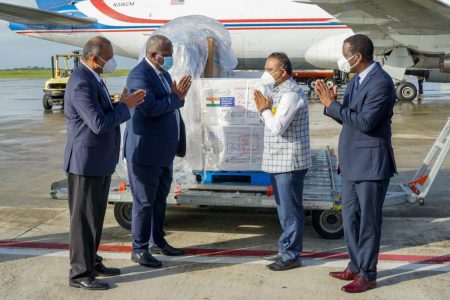 Prime Minister Mark Phillips (second from left) and Indian High Commissioner to Guyana Dr. K.J. Srinivasa (second from right) greeting each other yesterday at the airport. Also in this Department of Public Information photo are Minister of Health Dr Frank Anthony (left) and Minister of Foreign Affairs Hugh Todd.