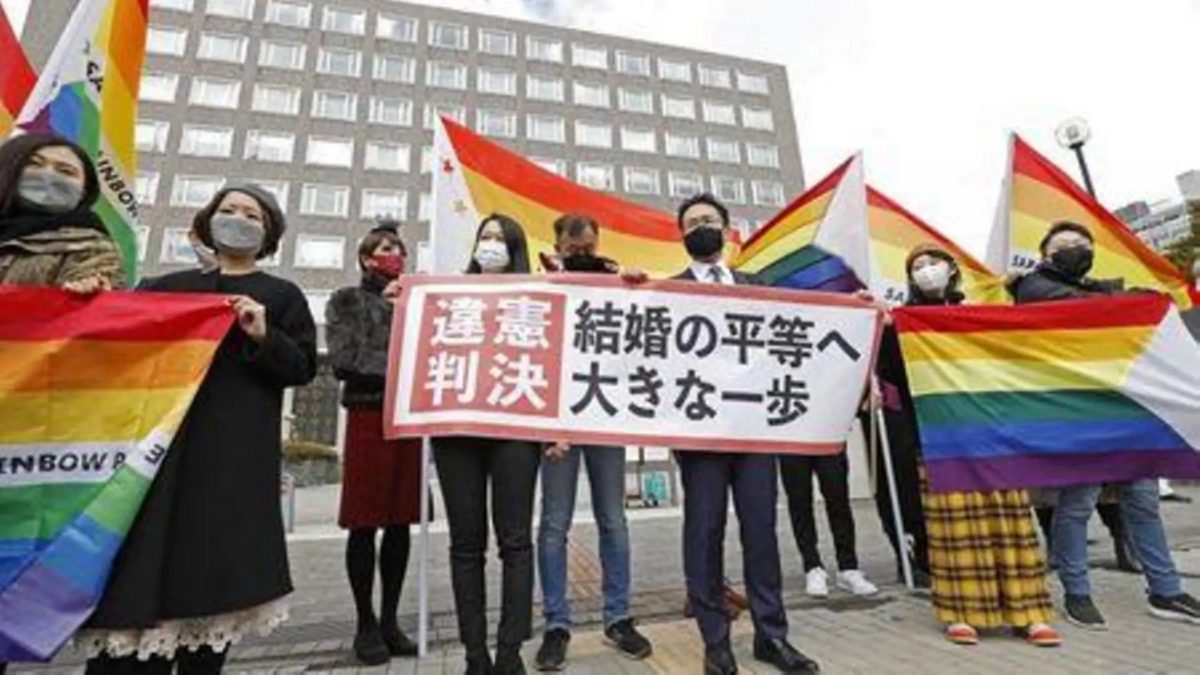 Plaintiffs' lawyers and supporters show a banner that reads 'Unconstitutional decision' after a district court ruled on the legality of same-sex marriages outside Sapporo district court in Sapporo, Hokkaido, northern Japan March 17, 2021, in this photo taken by Kyodo. Mandatory credit Kyodo/via REUTERS