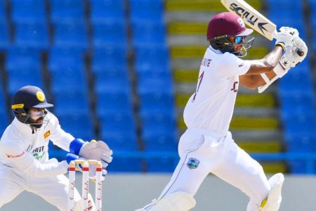 Captain Kraigg Brathwaite plays a shot  en-route to his unbeaten 99 on day one of the second Test yesterday. 