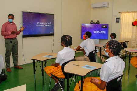Students of the Brickdam Secondary School in a matrices lesson inside of their smart classroom. (Ministry of Education photo)