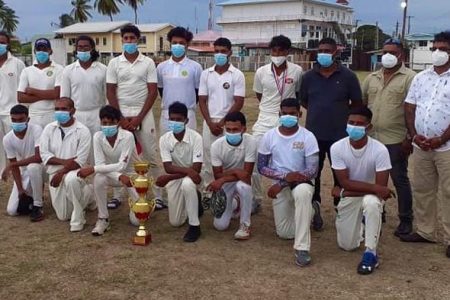 Port Mourant Cricket Club team pose for a photo after winning the Lillian Nandu Cup
