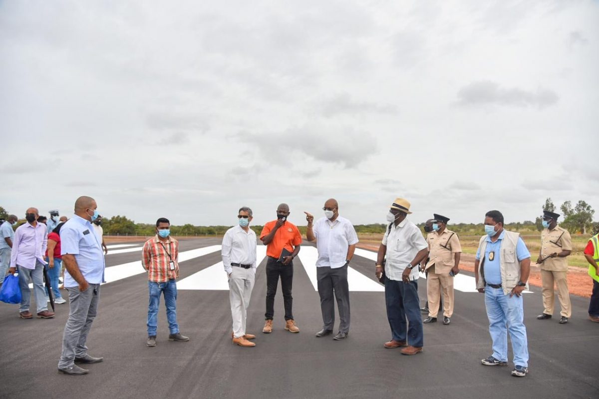 The Minister and his team inspecting the new runway (Ministry of Public Works photo)