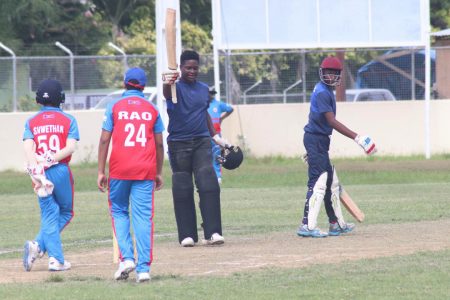 Rivaldo Phillips acknowledges the cheers of his peers after bringing up his first century for GCC (Romario Samaroo photo)
