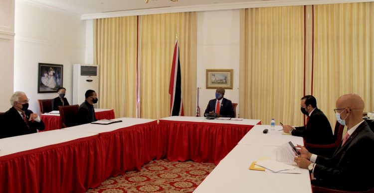 Minister of Health Terrence Deyalsingh, left, Minister of Foreign and Caricom Affairs Dr Amery Browne, Prime Minister Dr Keith Rowley, Minister of National Security Stuart Young and Permanent Secretary to the Prime Minister Maurice Suite listen to the call between PM Rowley and China President Xi Jinping via teleconference at the Diplomatic Centre, St Ann’s, yesterday. (OFFICE OF THE PRESIDENT)