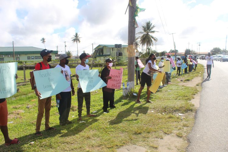 Relatives of Vanessa Lewis-Sahadeo protesting in front of the New Amsterdam Hospital yesterday morning. 