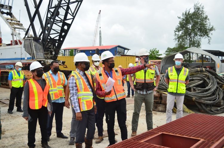 Minister Deodat Indar (left) on a tour of the shore base site yesterday