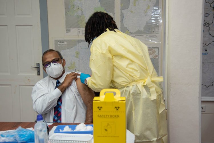 Health Minister Dr. Frank Anthony being administered his COVID-19 vaccine. (DPI photo)