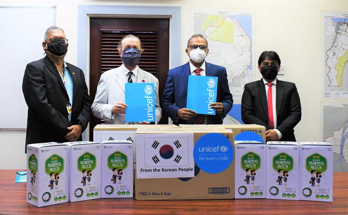 From left are Honorary Consul of the Republic of Korea in Guyana Ramesh Dookhoo, Minister of Health Dr Frank Anthony, UNICEF Representative Nicolas Pron and UNICEF Deputy Representative Irfan Akhtar at the symbolic handover of 20,000 pieces of high-quality KF94 face masks to the Ministry of Health on Friday. The total donation amounts to 40,000 masks donated by the Republic of Korea, through UNICEF for frontline workers. (UNICEF photo)