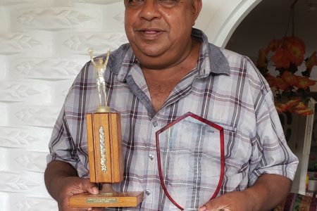 Pitamber Panday with awards he has received for service to the livestock sector 