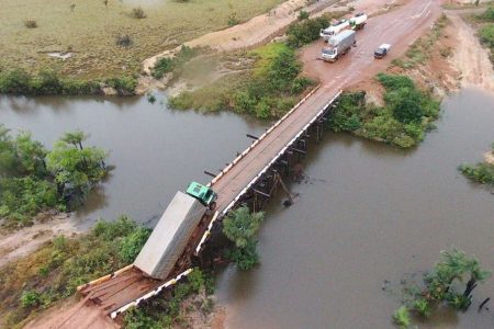 An overhead shot of the truck and the collapsed bridge.