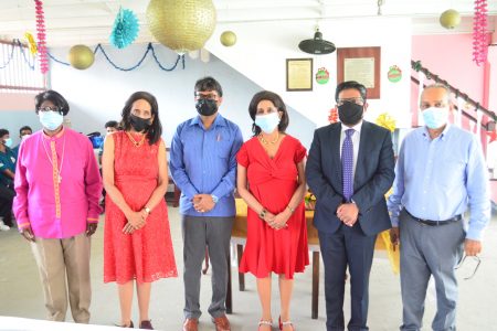 Kella (fourth from left) and Pamela Ramsaroop (second from left) with their special invitees (Photo by Orlando Charles)