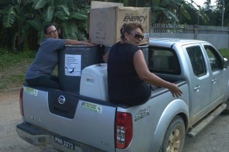 Toshao Whanita Phillips and former councillor Sharon La Rose delivering donations prior to the COVID-19 pandemic