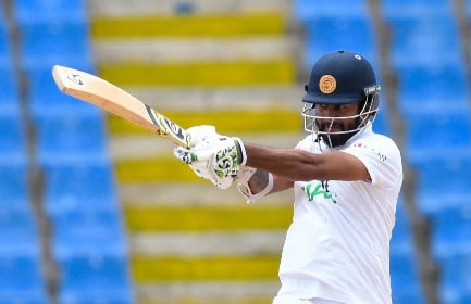 Sri Lanka’s captain Dimuth Karunaratne pulls during his top score of 75 on Friday’s final day.