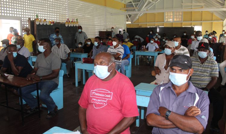 Farmers and residents at the Number 48 Primary School on Saturday to meet with the Minister of Agriculture, Zulfikar Mustapha