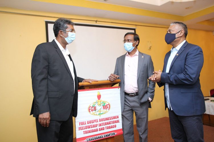 Dr Roger Hosein, left, speaks with the head of the Full Gospel Business Men’s Fellowship International, Chaguanas Chapter, Vishnu Charran, centre, and Commander Garvin Heerah during yesterday’s discussion on the T&T Business Outlook 2021-2022 at Passage to Asia, Chaguanas.