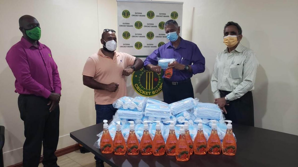 Manager of GuyBiz Ishwar Singh (second from left) hands over the supplies to GCB’s Assistant Secretary, Davteerth Anandjit, in the presence of GCB secretary, Ronald Williams (right) and Territorial Development Officer Colin Stuart