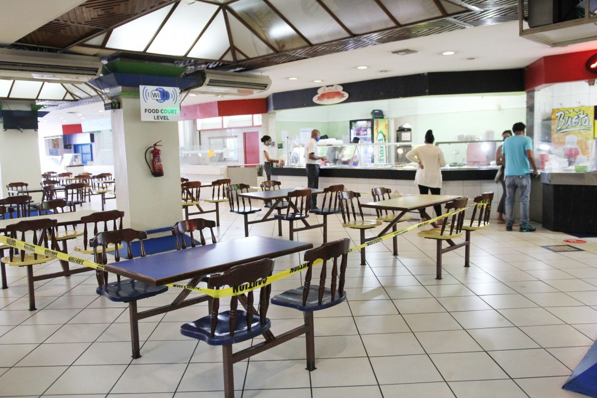 As customers purchase their meals, the eating area is blocked off at the Town Centre Mall, Food Court, as in house dining has been suspended under the new Covid-19 regulations on Frederick Street Port-of-Spain.