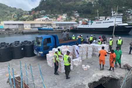 Emergency supplies from Guyana being offloaded from the ‘Miss Meena’ vessel yesterday in St. Vincent
