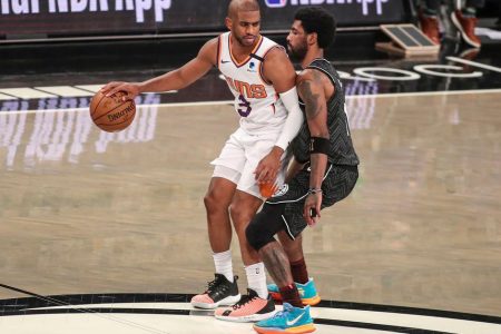 Brooklyn, New York, USA; Phoenix Suns guard Chris Paul (3) is guarded by Brooklyn Nets guard Kyrie Irving (11) at Barclays Center. Mandatory Credit: Wendell Cruz-USA TODAY Sports