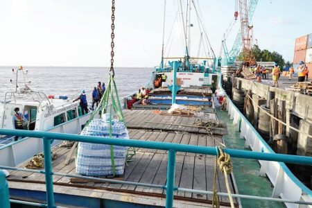 Cases of bottled water being loaded on to the vessel. (Photo taken from Mark Phillips’ Facebook page)