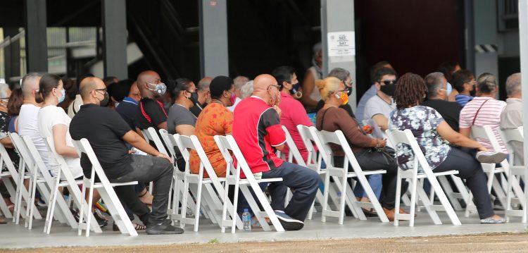 Members of the public wait to get the COVID-19 vaccine at the Grand Stand, Queen’s Park Savannah, Port-of-Spain, last Sunday.