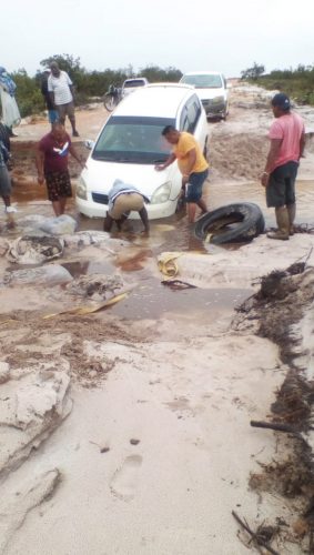 Residents trying navigate the washed away section of the trail 