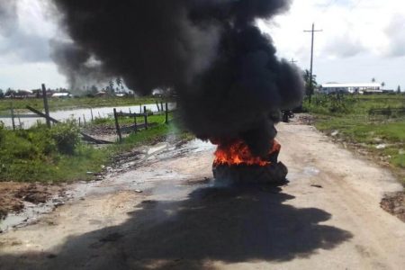 Tyres set on fire in Yakusari, Black Bush Polder, on Friday morning by residents angry over continued flooding. The fires were quickly put out by police. 