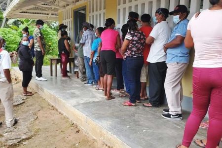 Villagers lining up to vote in Moraikobai