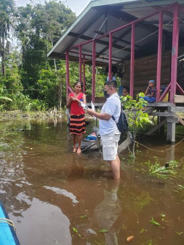 Northwest flood: A family in Santa Cruz, Region One surrounded by floodwater yesterday