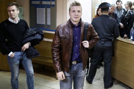 Opposition blogger and activist Roman Protasevich (right) arrives for a court hearing in Minsk (Reuters photo)
