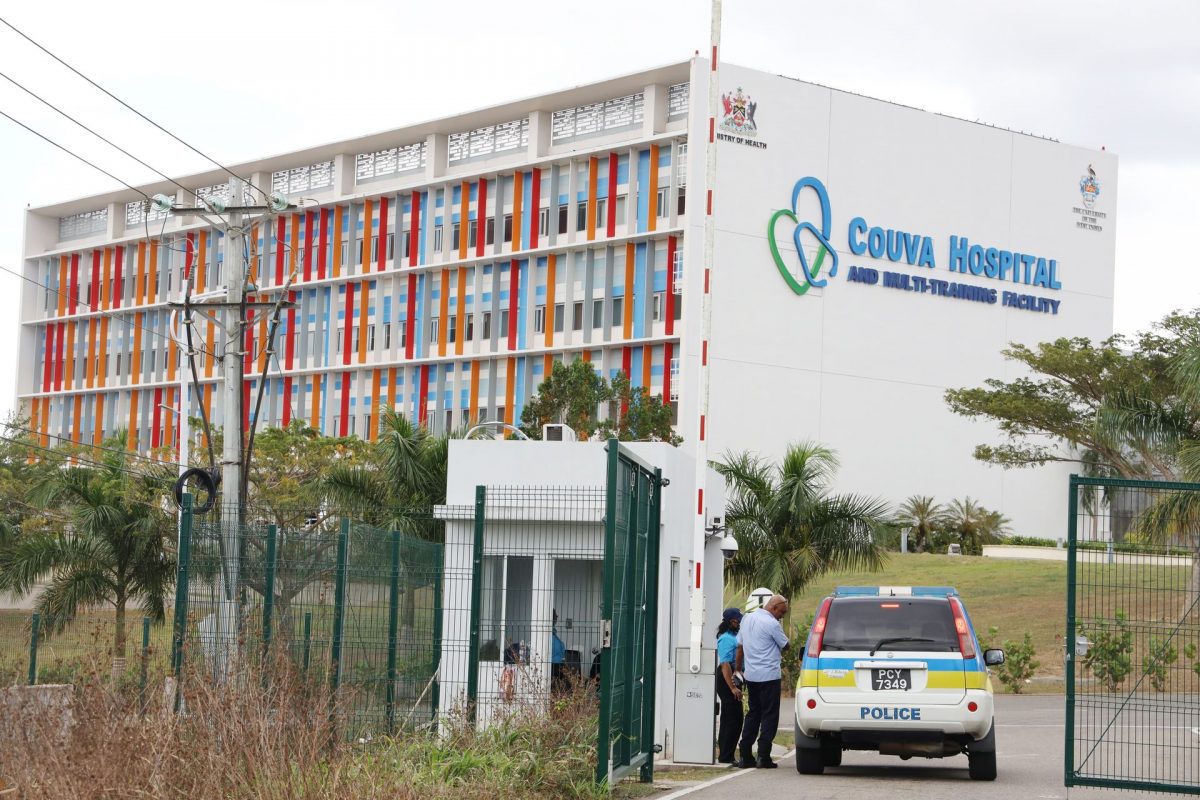 Police entering the Couva Hospital recently