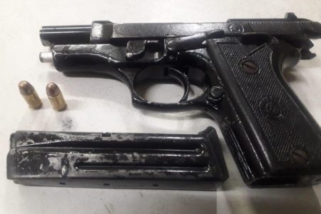 The .32 pistol and matching ammunition that were found. (Saved as Brickdam Police Station arrests B)