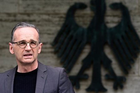 German Foreign Minister Heiko Maas addresses the media during a statement at the Foreign Ministry in Berlin, Germany, Friday, May 28, 2021. Germany has reached an agreement with Namibia that will see it officially recognize as genocide the colonial-era killings of tens of thousands of people and commit to spending a total of 1.1 billion euros ($1.3 billion), largely on development projects. (Tobias Schwarz/Pool Photo via AP)