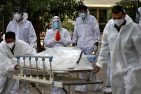 Relatives react as healthcare workers pull a stretcher carrying the body of a person who died from the coronavirus disease (COVID-19), at a mortuary in Ahmedabad, India, May 8, 2021. REUTERS/Amit Dave