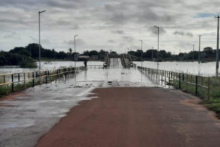 A section of the main bridge in Lethem partially covered by water from the swollen river (CDC photo)
