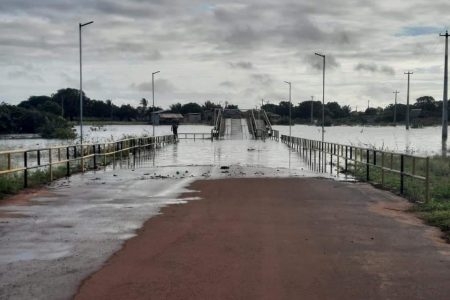 A section of a main bridge in Lethem partially covered by water overflowing from the river (CDC photo)
