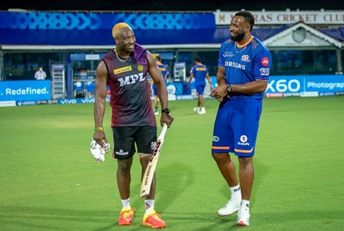 IN HAPPIER TIMES: KKR’s Andre Russell shares a joke with Mumbai”s Kieron Pollard during the tournament.
