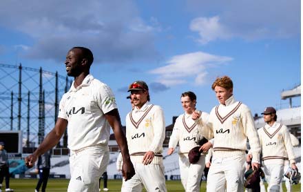 Kemar Roach leads Surrey off the field after bowling them to victory over Hampshire at the Oval on Saturday.
