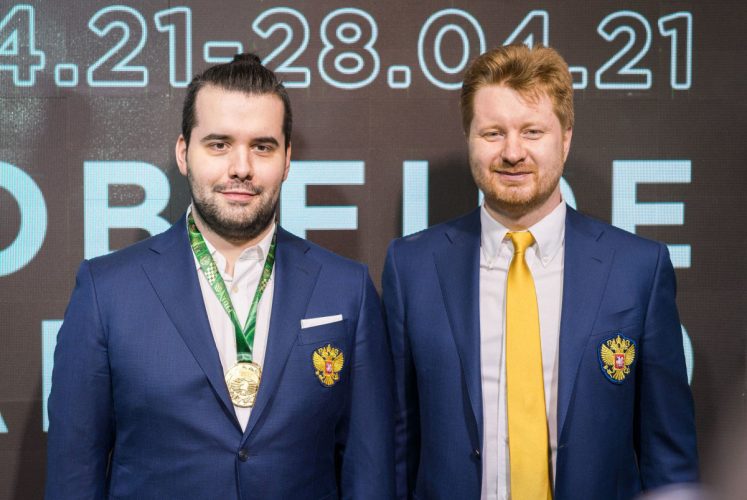 Russia’s Ian Nepomniachtchi (left) poses with his coach Vladimir Potkin during the closing ceremony of the Candidates Tournament. (Photo: Lennart Ootes/FIDE) 
