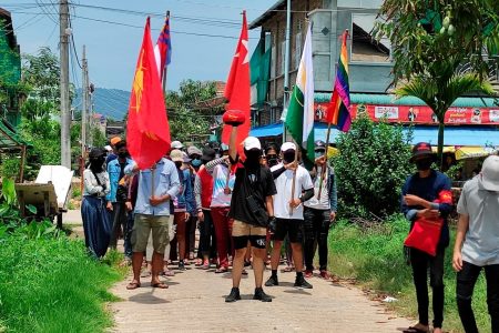 Demonstrators carry flags as they march to protest against the military coup, in Dawei, Myanmar April 27, 2021. Courtesy of Dawei Watch/via REUTERS